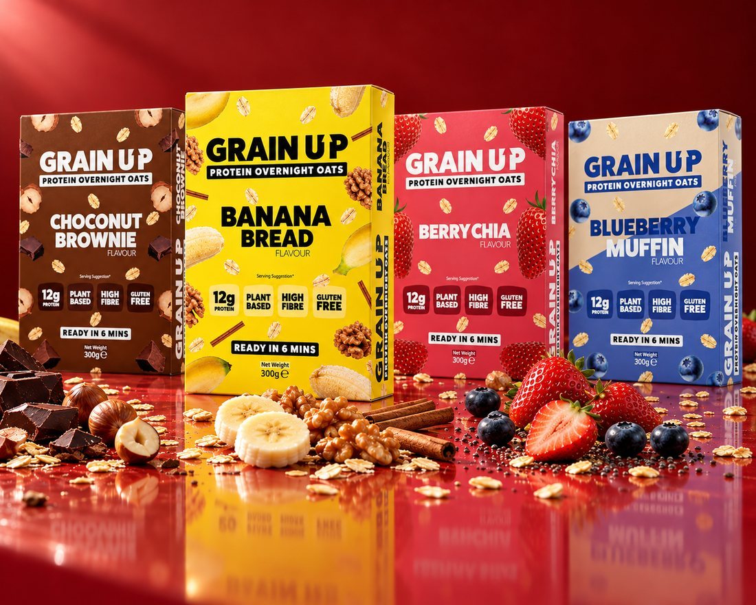 All four Grain Up 300g boxes with their ingredients on a red surface