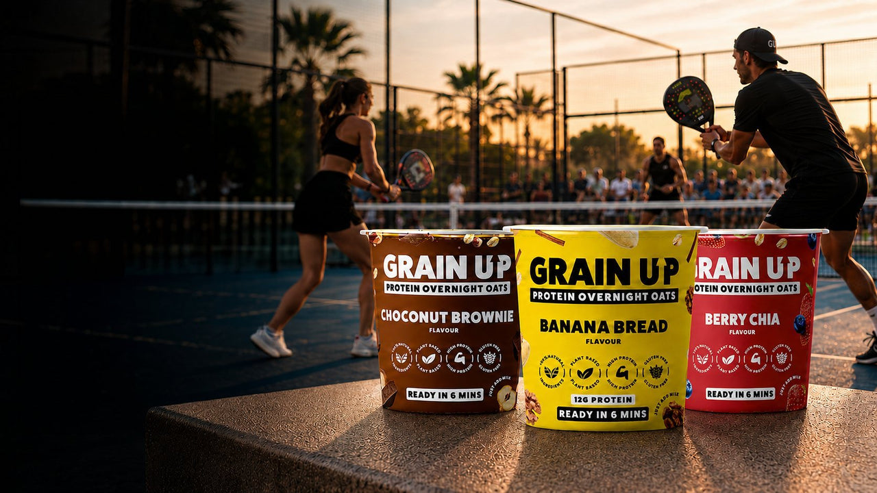 Grain Up pots courtside while two people play padel at sunset